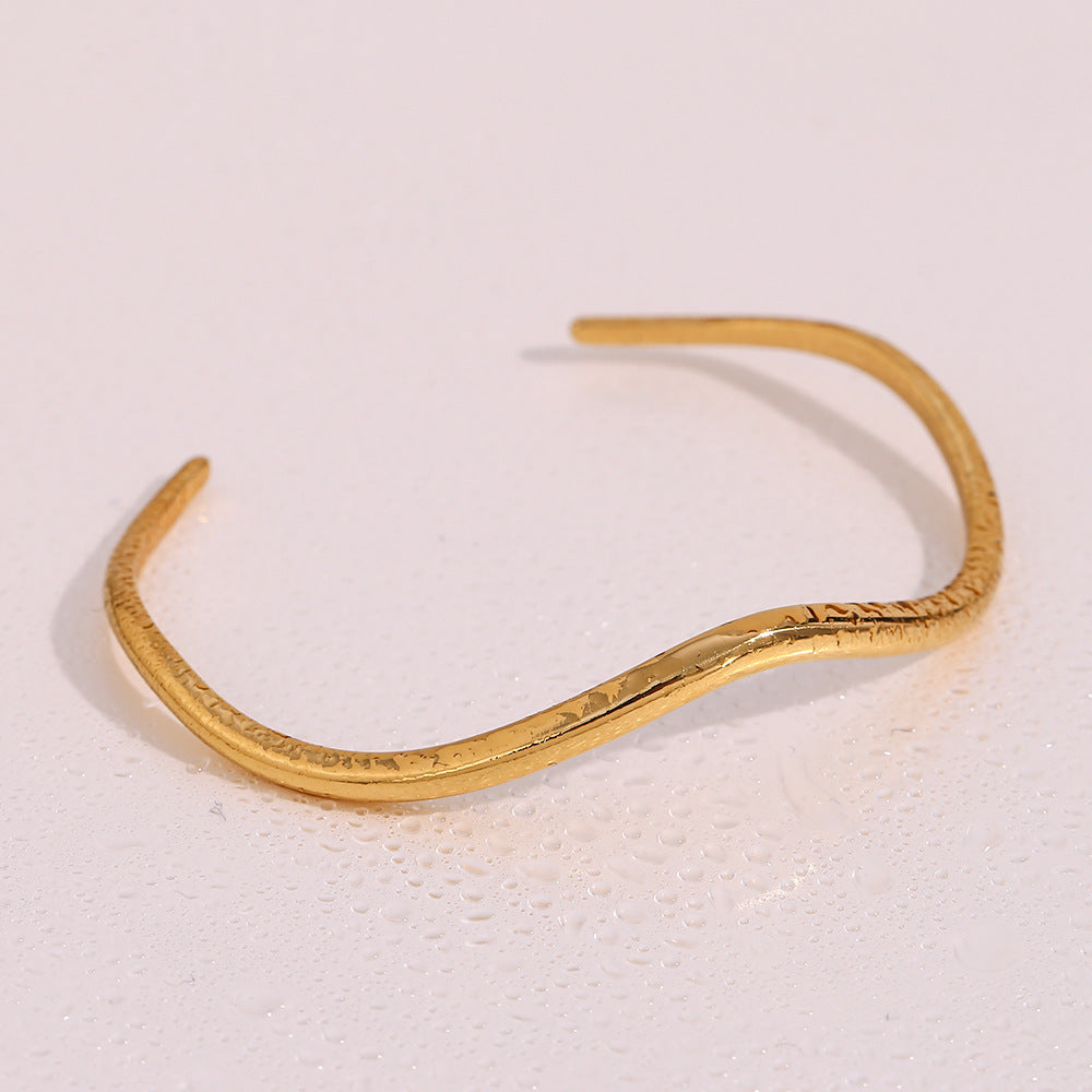 Luminous Elegance Golden Arc Bracelet