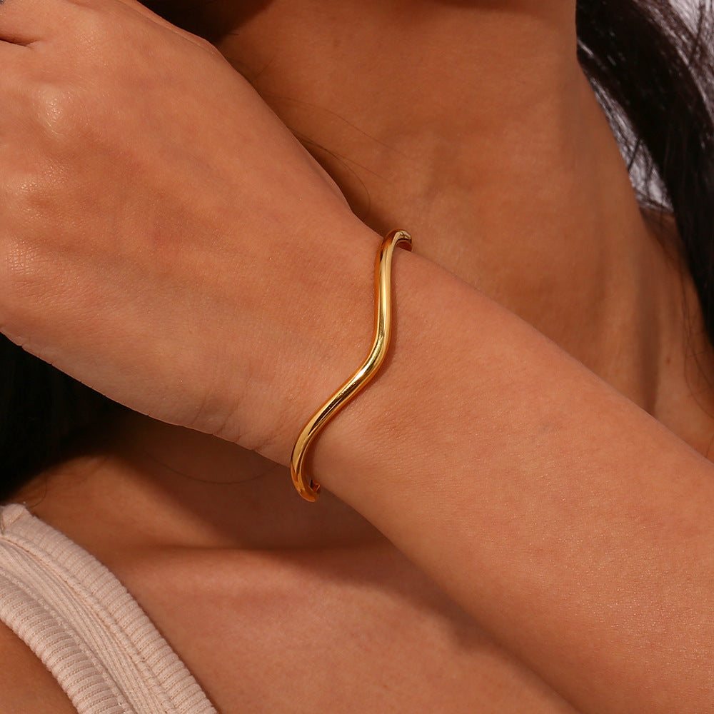 Luminous Elegance Golden Arc Bracelet